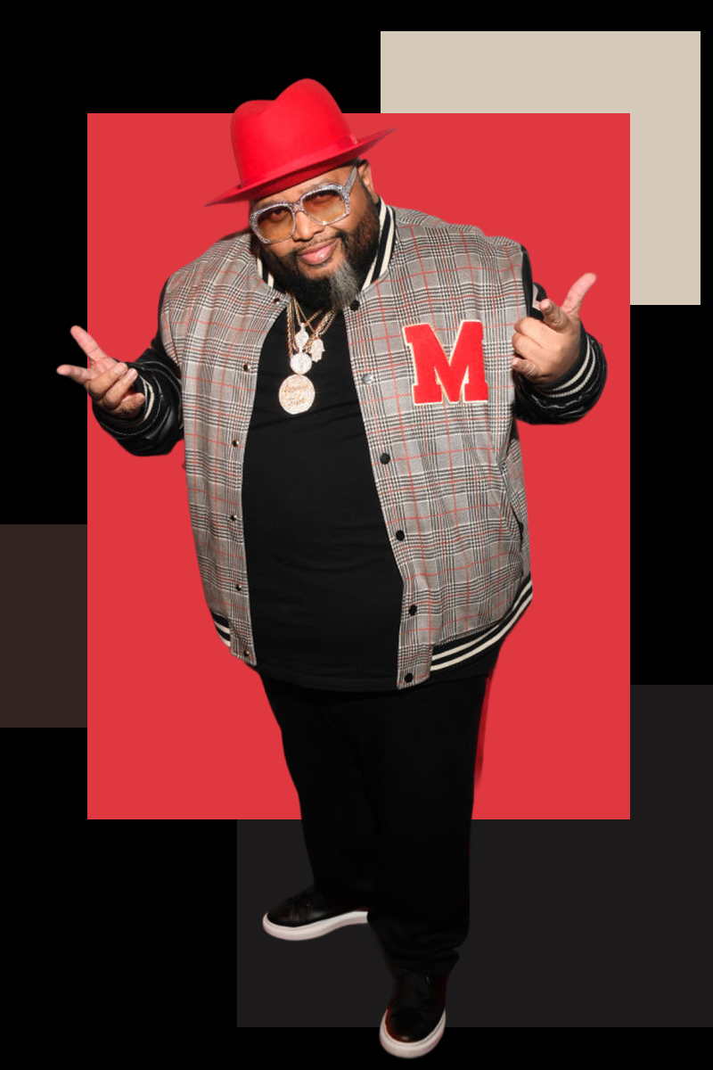 Jazze posing in a letter jacket and gold chain