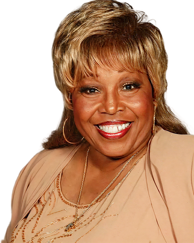 Denise smiles to the camera