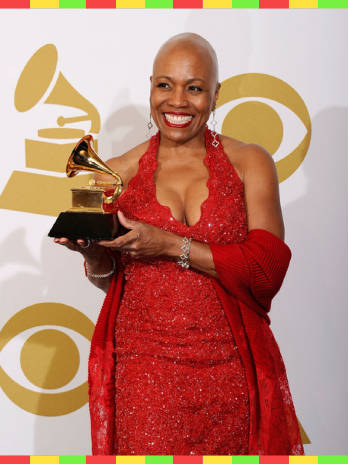 Dee Dee holds her Grammy award trophy